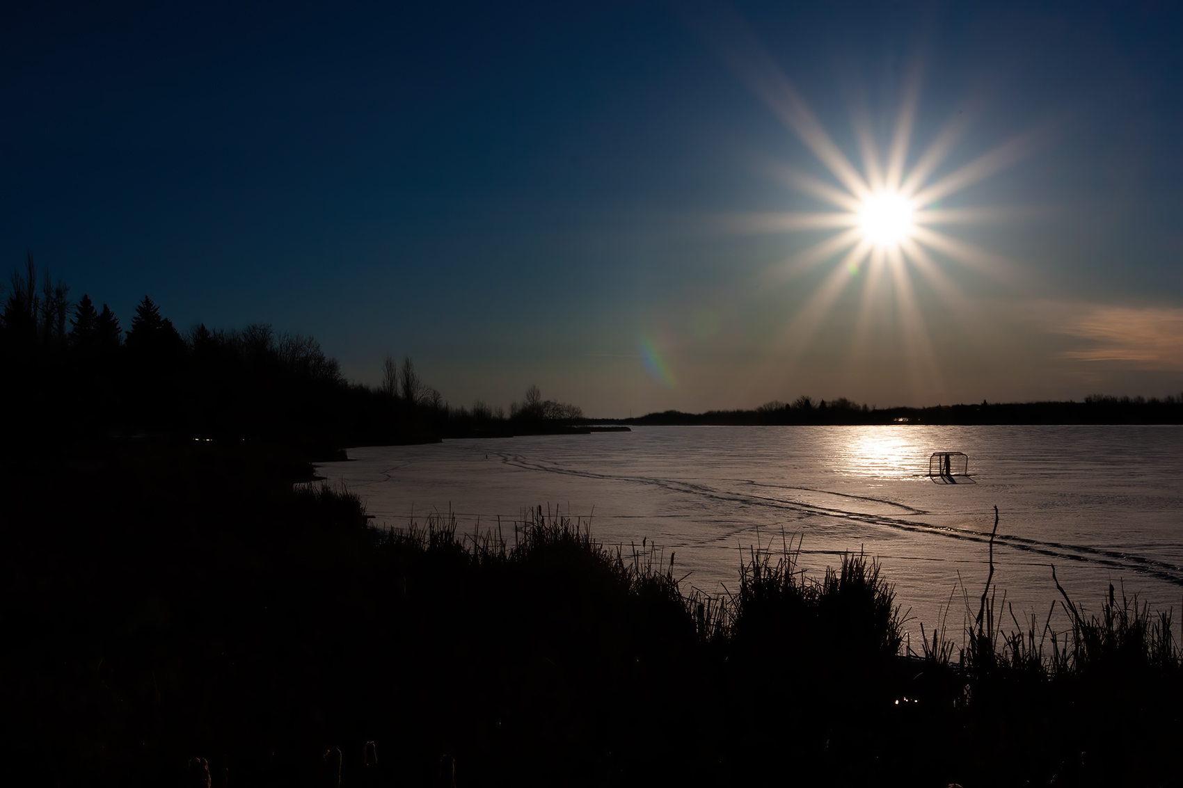 Sun over the hockey goals, Telford Lake, Leduc, Alberta, 2024-03-10