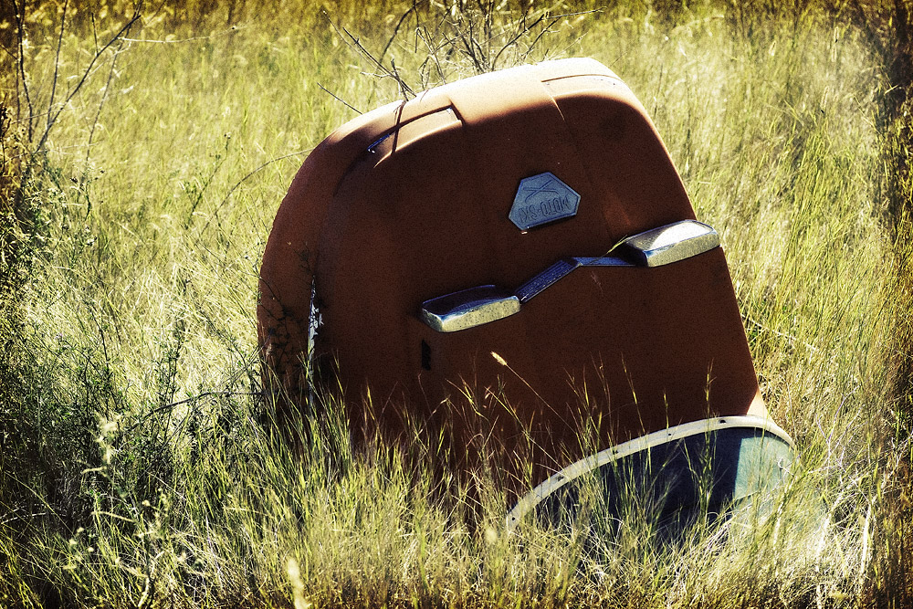 Somewhat incongruous: Discarded Moto-Ski hood in the grass