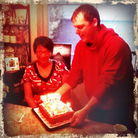Zane presenting Janelle with her cake.