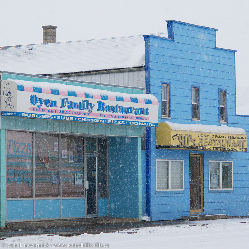 Customers chased away by a spring snow squall, Oyen, Alberta