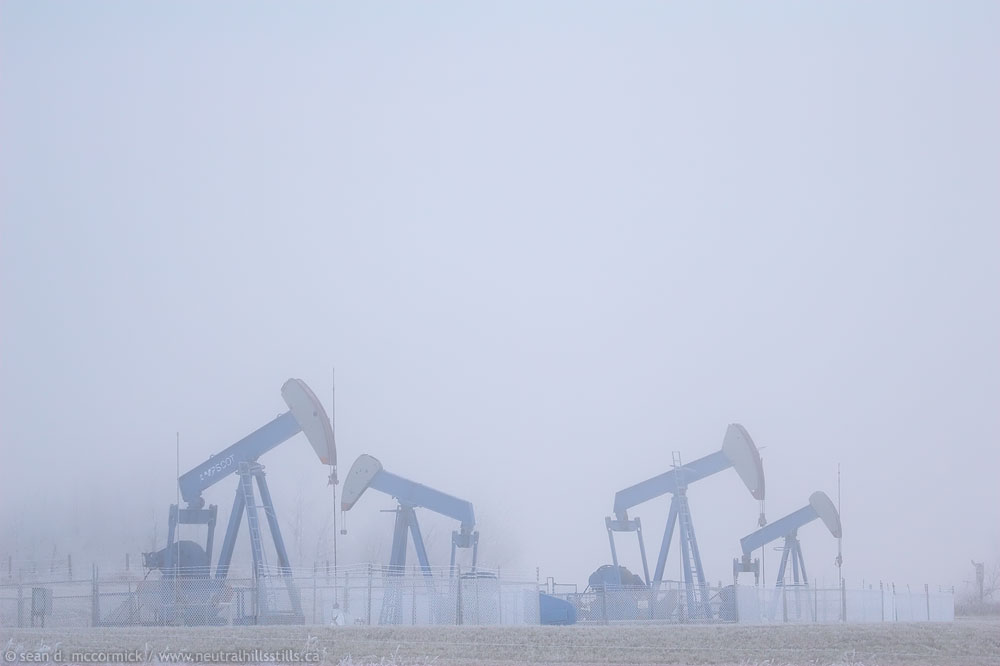 Pump jacks in fog east of Consort on Hwy 12