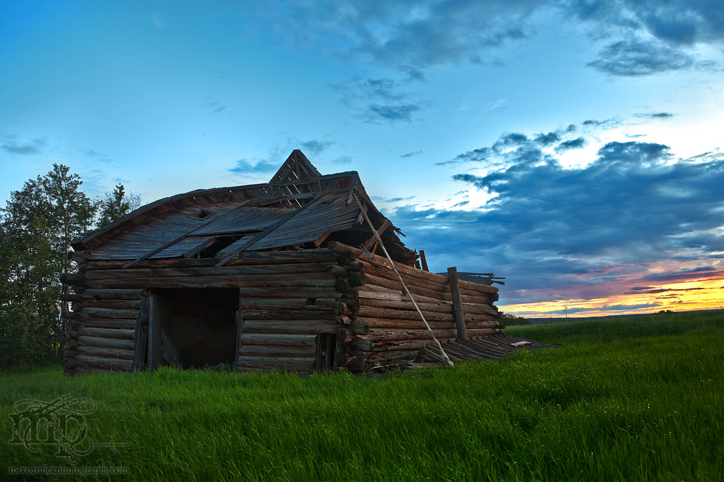 Collapsed barn near Dawson Creek, BC at dusk