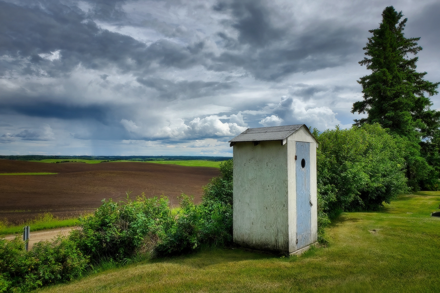 Some outhouse behind some church found on some drive, Somewhere, Alberta, 2020-07-19
