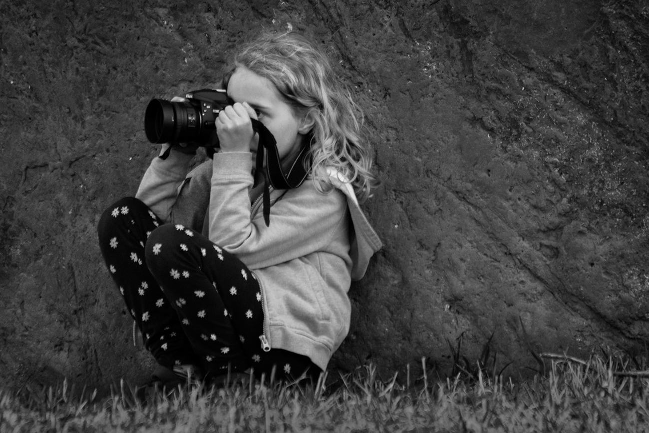 Keen Observer, Taking Photo Behind Gray Park Sign
