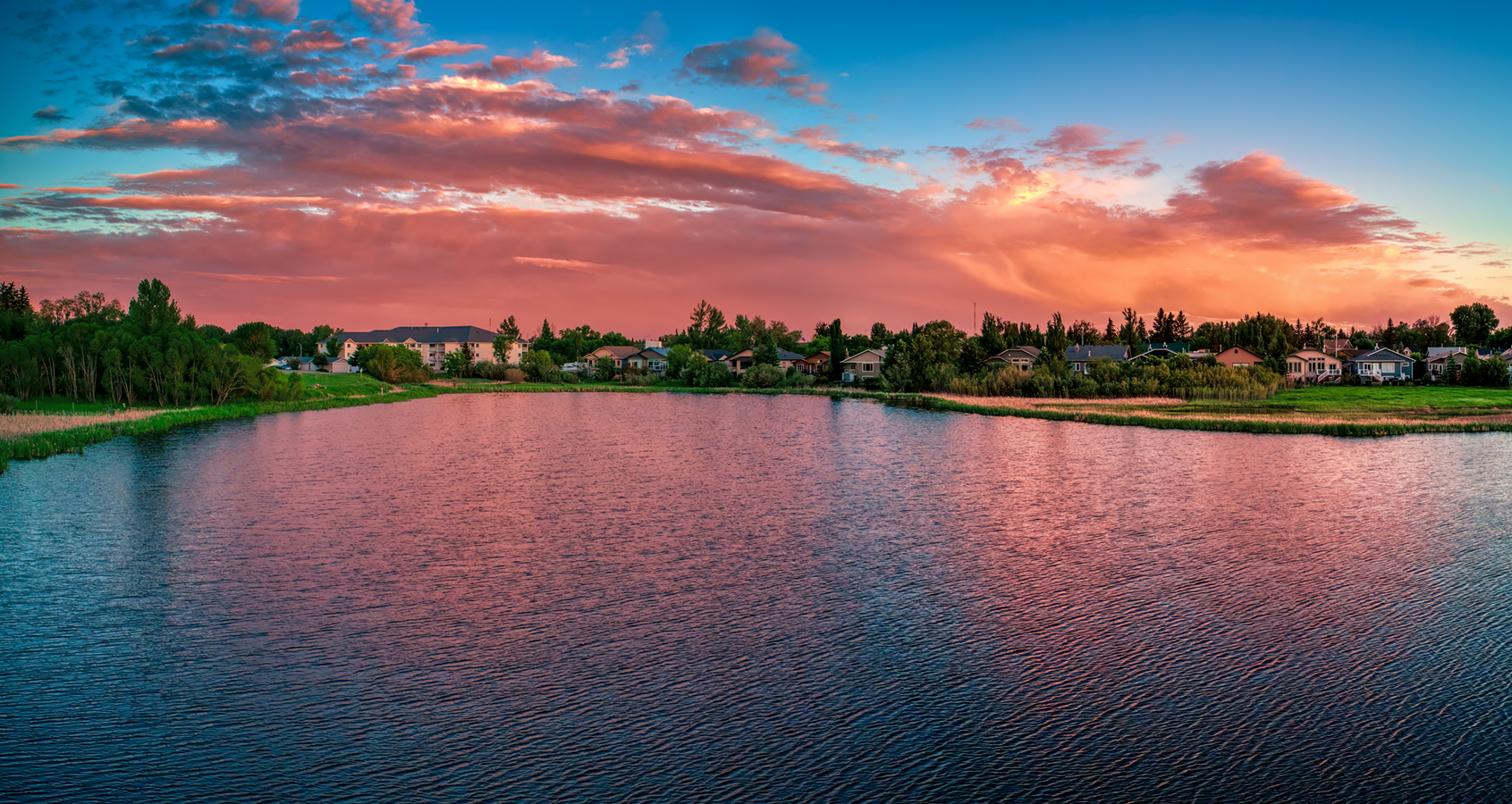 Alpenglow over Southmost Pond, Surface View, Gray's Park, Strathmore, AB,, 2022-06-22