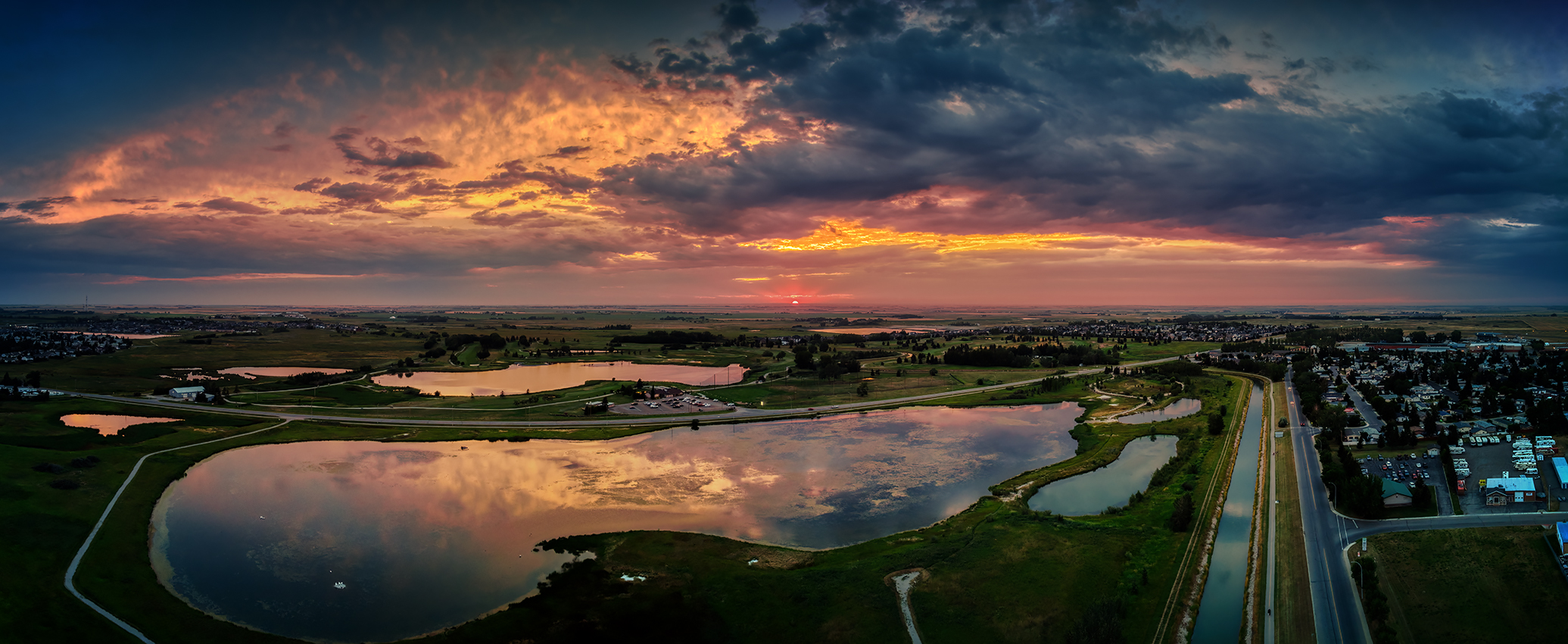 Sun tipping the horizon, Gray Pond, Strathmore, AB, 2022-08-10