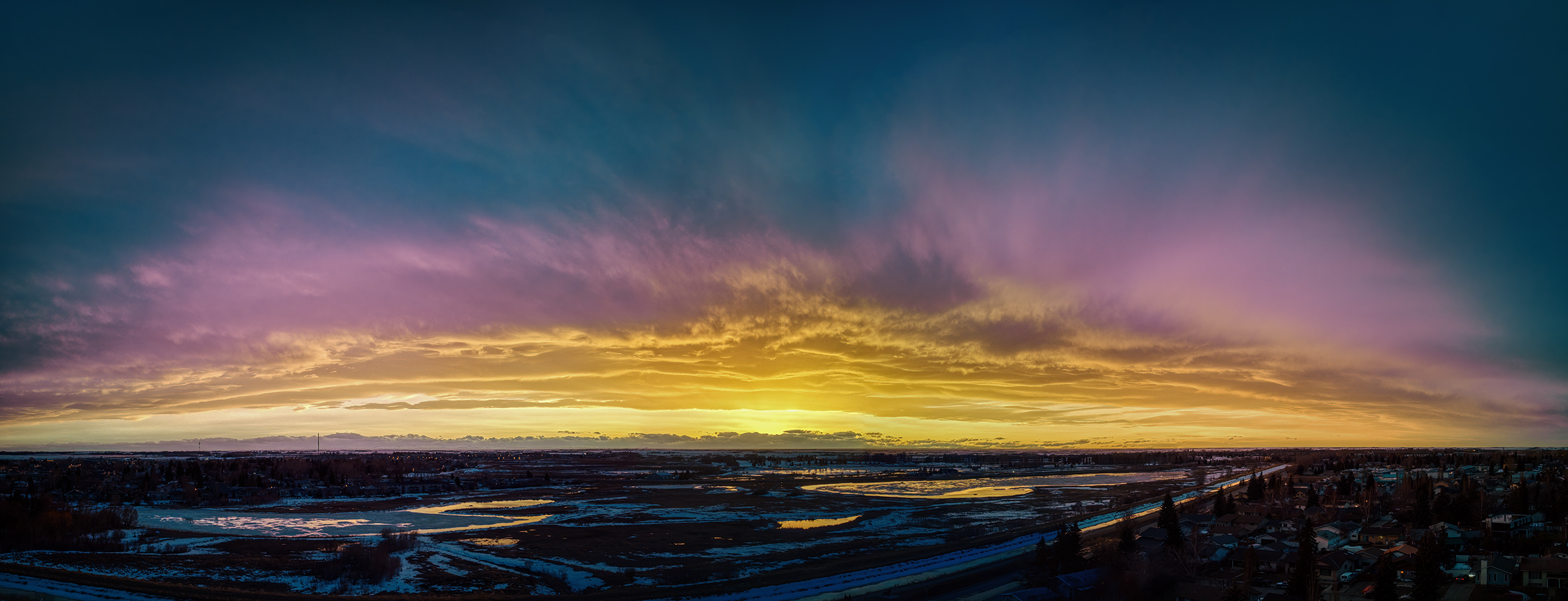 Sunset reflected in newly melting Gray's Ponds, Strathmore, Alberta, 2023-04-08
