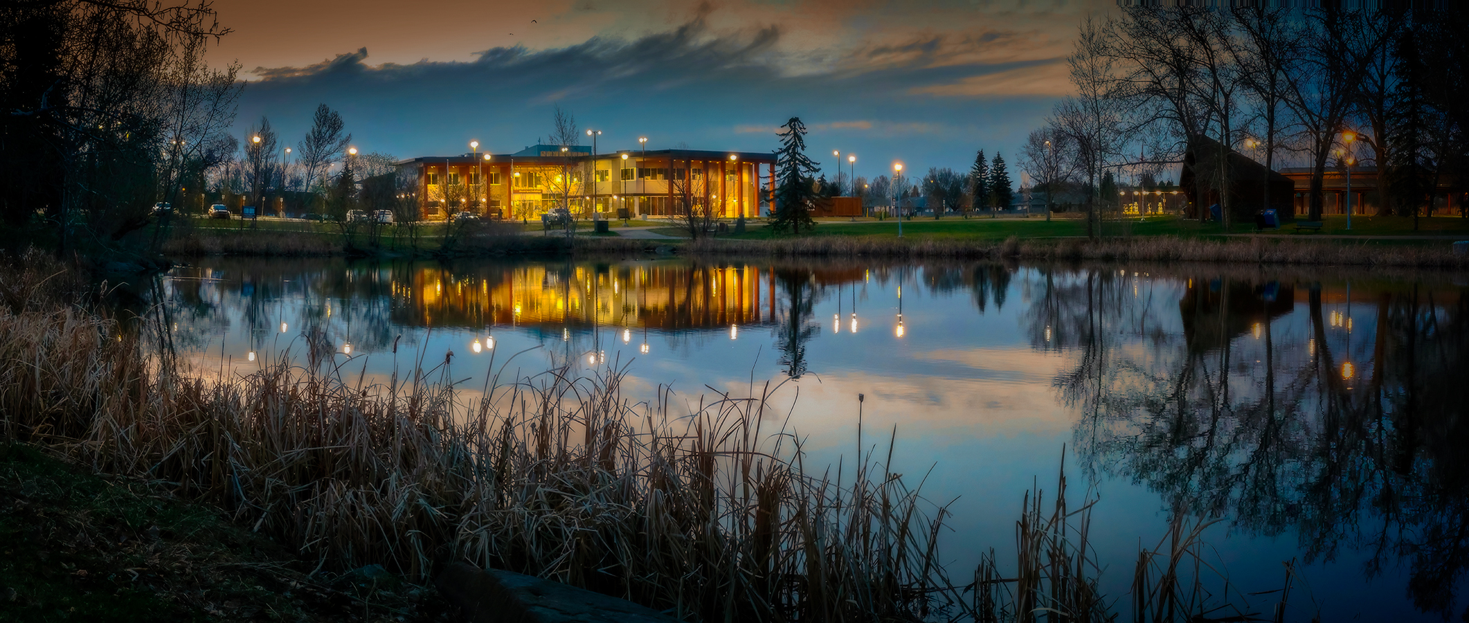 Municipal Building Reflected at Dusk, Gray Park, Strathmore, Alberta. 2023-05-03
