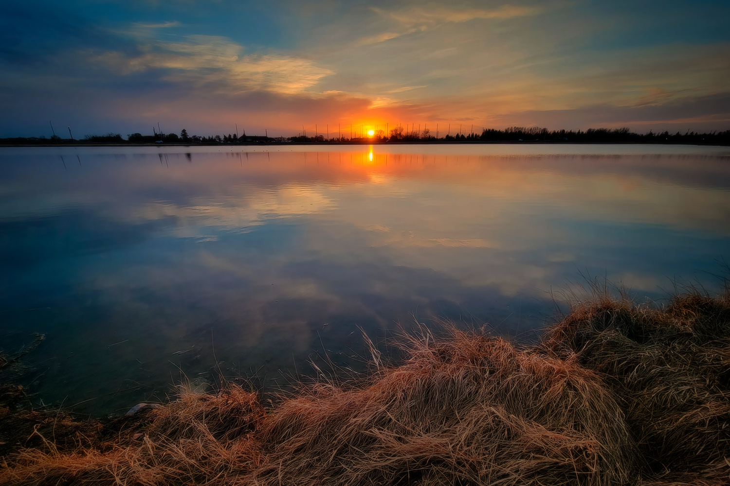 Sun Tipping the Horizon, Gray Pond, Strathmore, Alberta. 2023-05-03