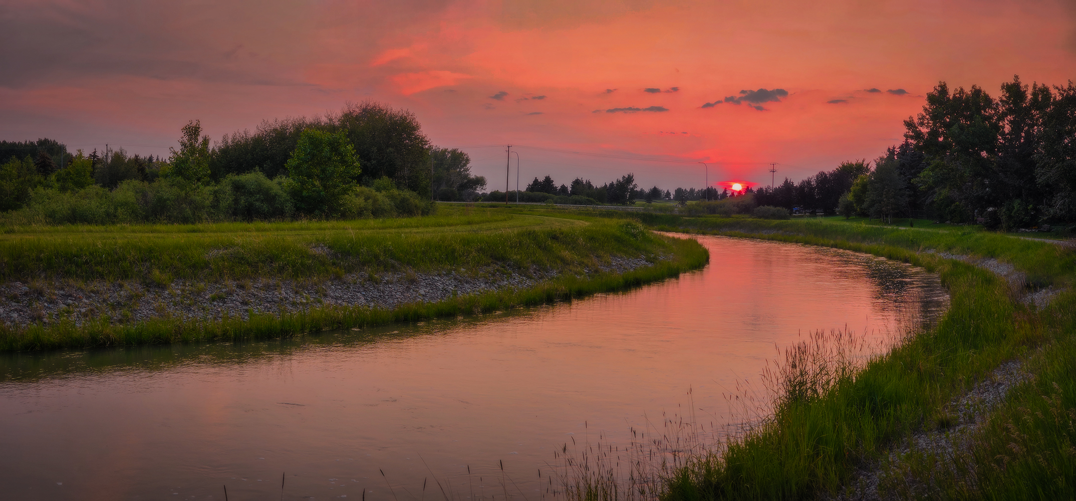 Sun Tipping the Horizon, Irrigation Canal North of Gray Park, Strathmore, Alberta. 2023-07-07