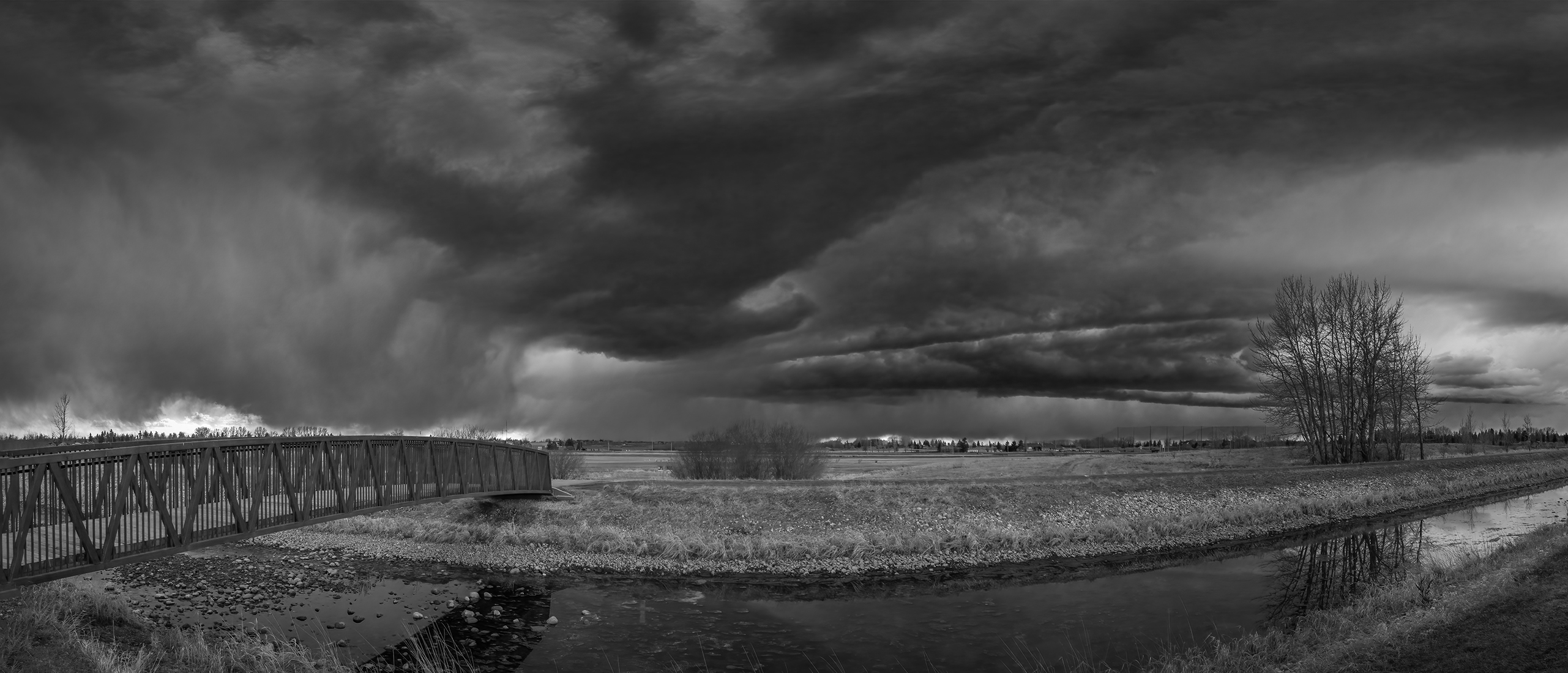 First good storm of the season, Tom Sadler Bridge, Strathmore, AB, 2024-04-09 (B&W)