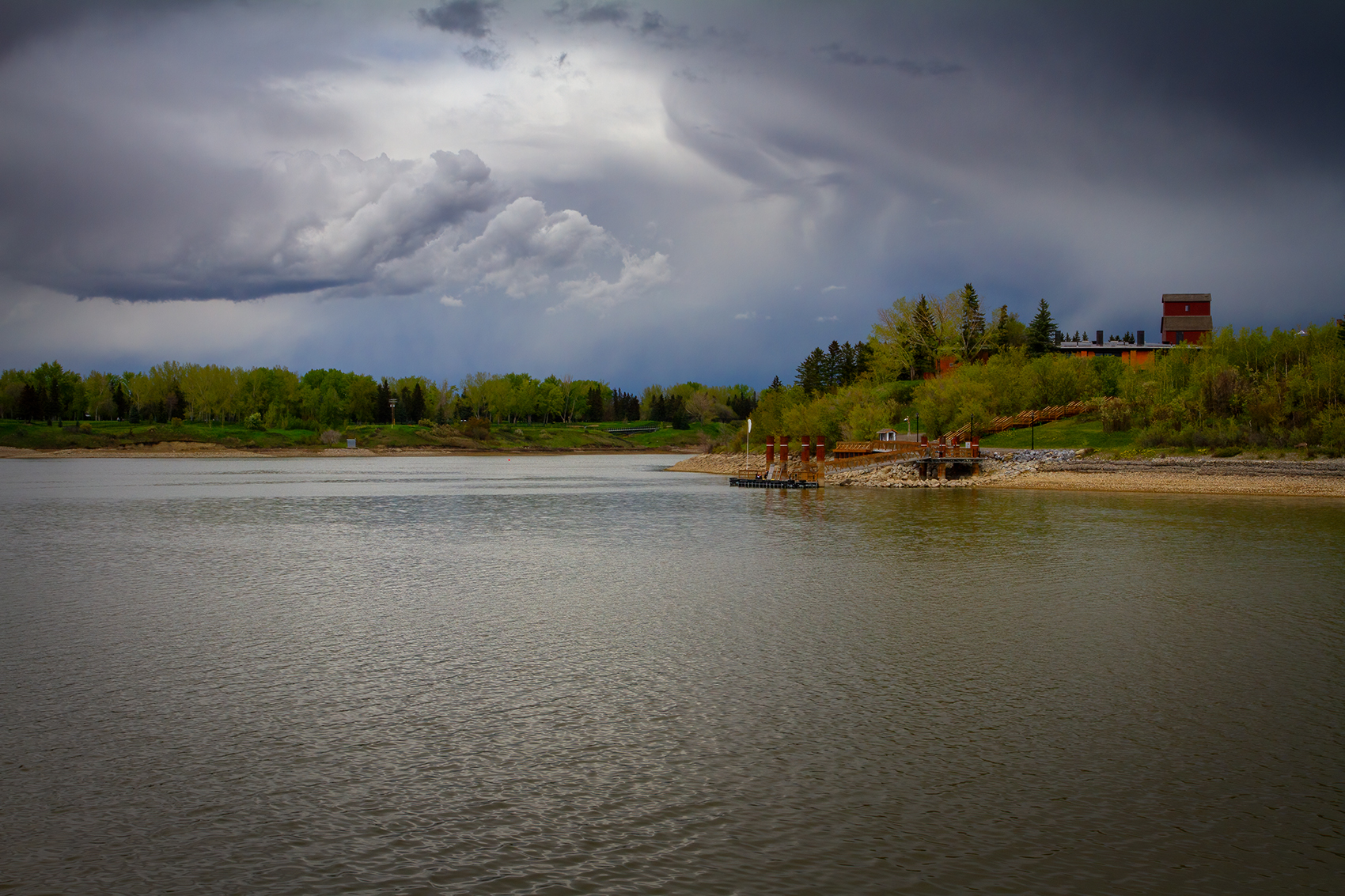 S.S. Moyie's pier backgrounded by the park, Heritage Park, Calgary, AB, 2024-05-25