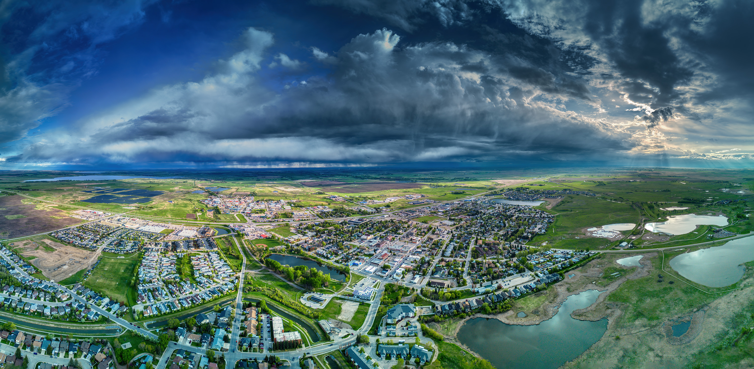 Unsettled weather, Thomas Drive looking Southwest, Strathmore, AB, 2025-05-20