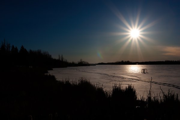 Sun over the hockey goals, Telford Lake, Leduc, Alberta, 2024-03-10