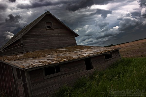 Settling barn under an unsettled sky