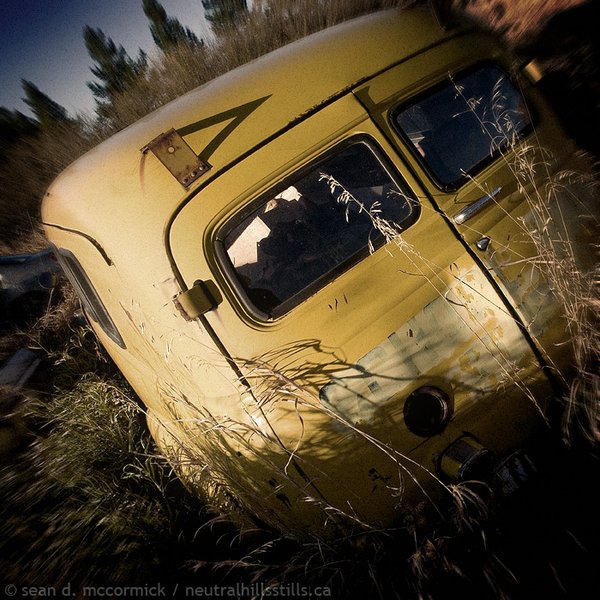 GMC school bus parked in the grass