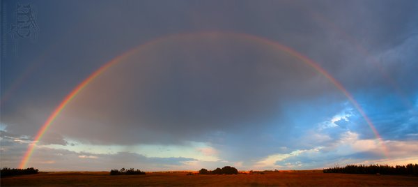 Sunrise, Aug 27, 2011: Morning rainbow over John's hay field