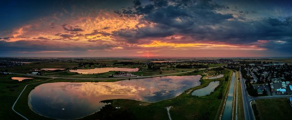 Sun tipping the horizon, Gray Pond, Strathmore, AB, 2022-08-10