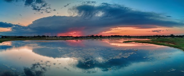 Isolated Cloud Burst Reflected in Gray's Pond, Strathmore, AB, 2022-08-12