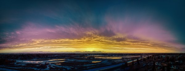 Sunset reflected in newly melting Gray's Ponds, Strathmore, Alberta, 2023-04-08