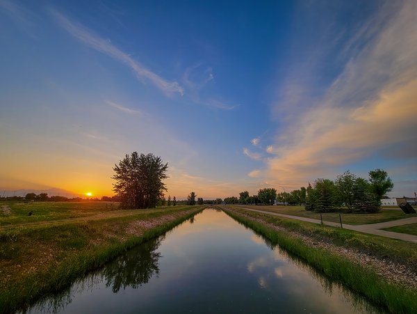 Sun Tipping the Horizon at the West Irrigation Canal, Strathmore, Alberta, 2023-05-31