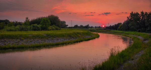 Sun Tipping the Horizon, Irrigation Canal North of Gray Park, Strathmore, Alberta. 2023-07-07