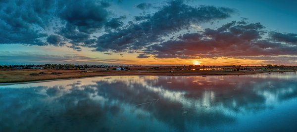 Sun Tipping the Horizon on the Greater Pond, Gray Park, Strathmore, Alberta, 2023-09-24