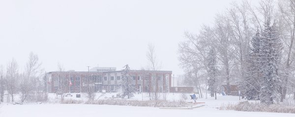 Municipal Building In Snow with Flags at Half Mast, Strathmore, Alberta, 2024-03-02
