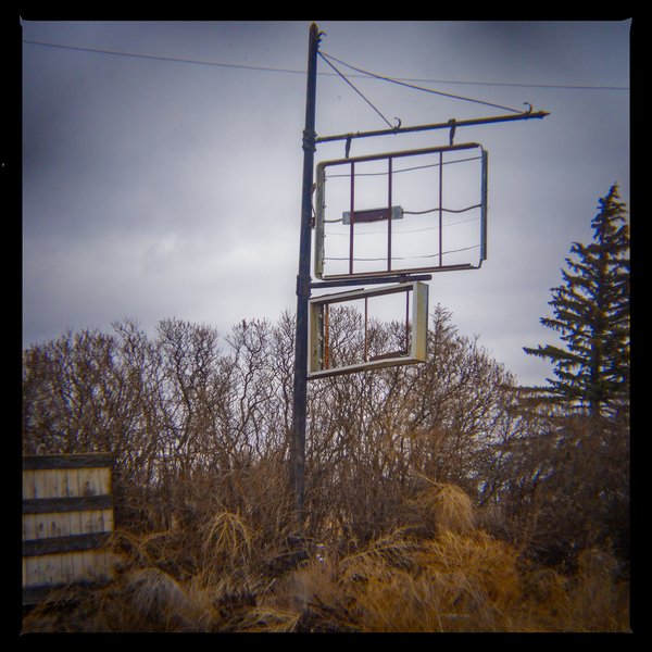 Sign of past times, Hwy 561 and Hwy 1, AB, 2024-04-06