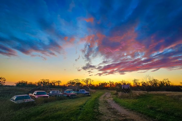 Sunset over the tanks, Sunnyridge Farm, Kirriemuir, AB, 2024-10-11