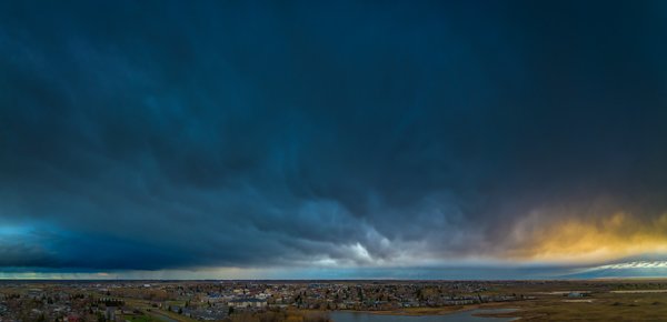 Here comes the rain again, Thomas Drive looking East, Strathmore, AB, 2025-04-29