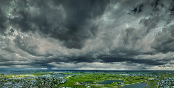 The forecast did mention light showers, Thomas Drive looking West, Strathmore, AB, 2025-05-20