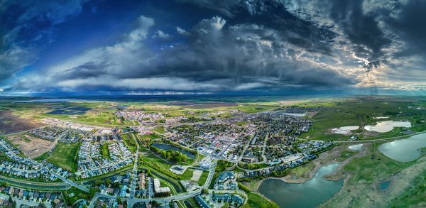 Unsettled weather, Thomas Drive looking Southwest, Strathmore, AB, 2025-05-20