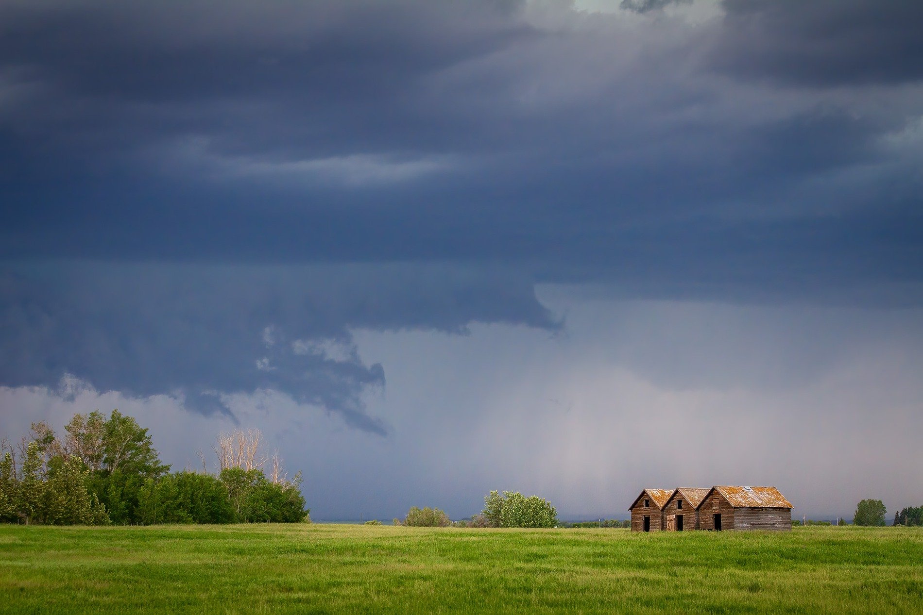 Sheds about to get washed, East of Strathmore, AB, 2026-06-20