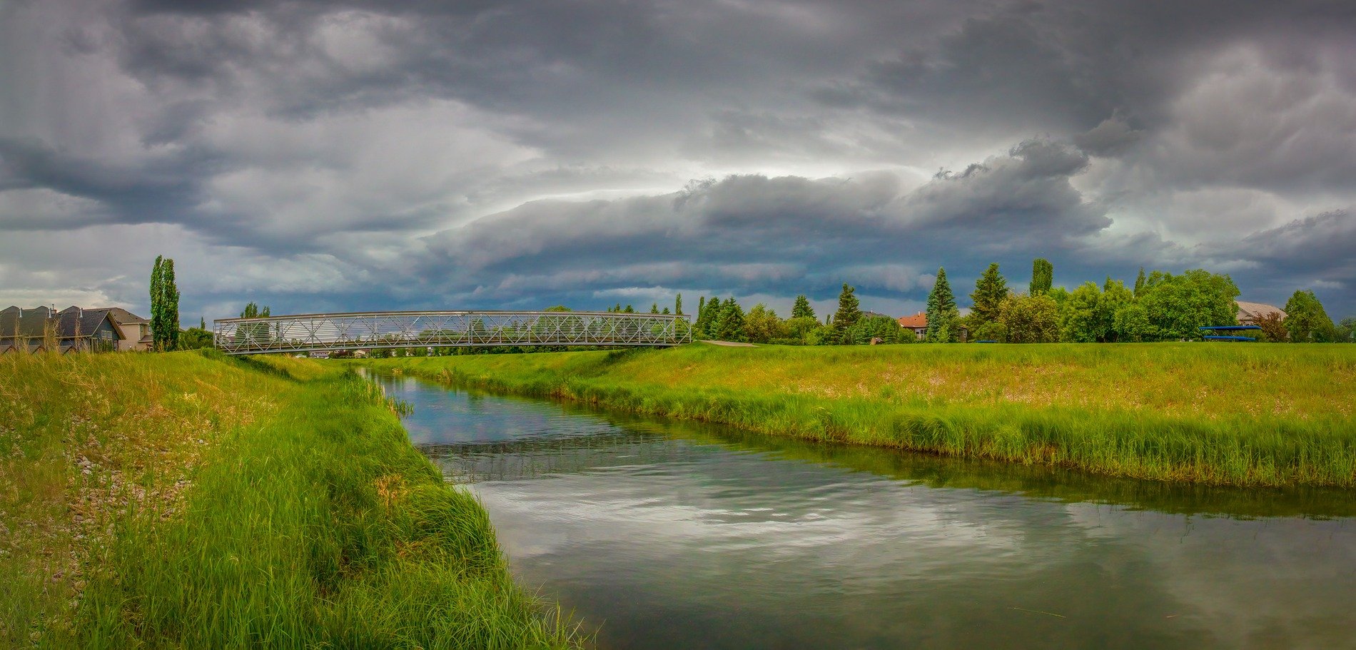 Wallking bridge, Lion's Park with incoming storm, Strathmore, AB, 2026-06-20